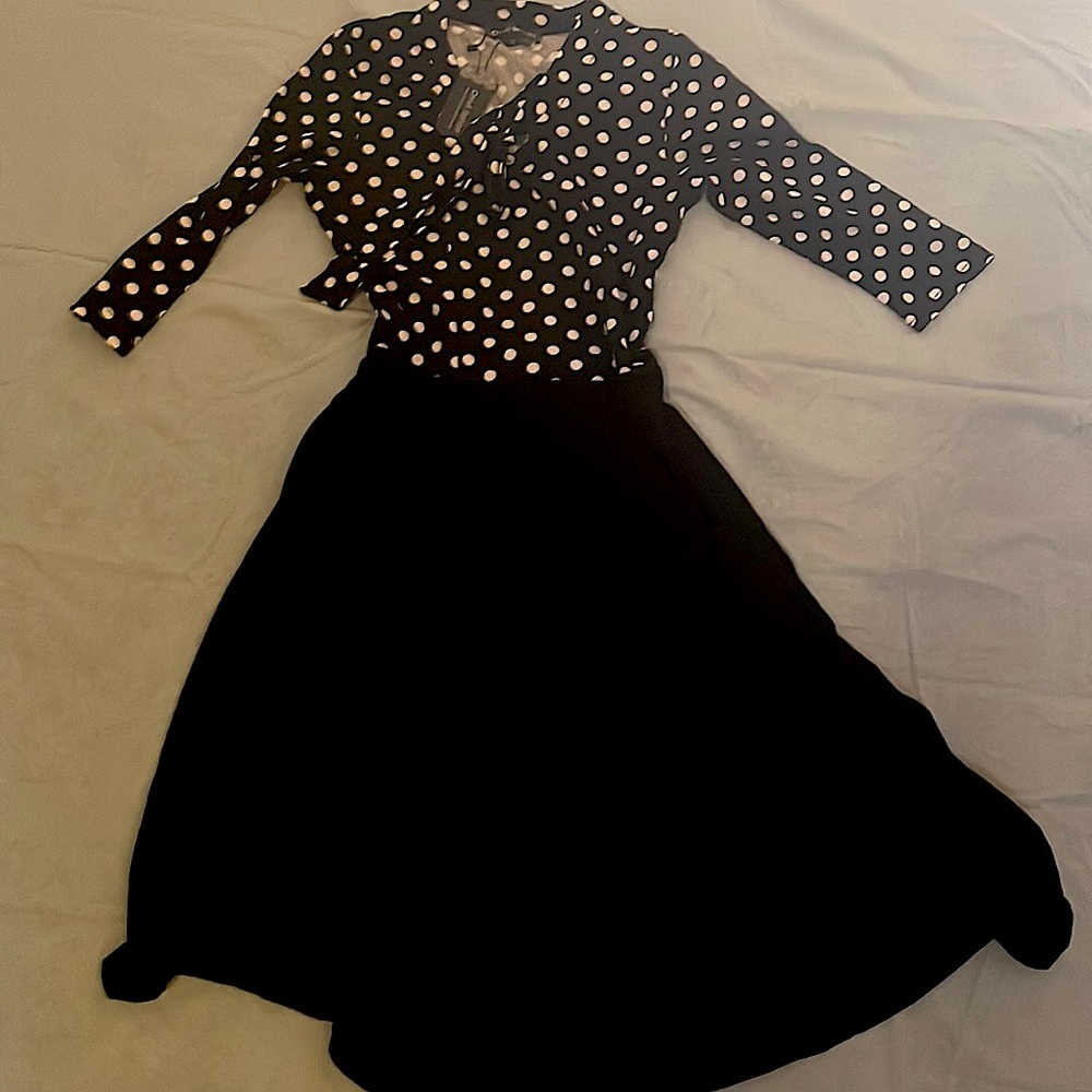 Super cute on and so soft! Great for work. 65% cotton 35% polyester